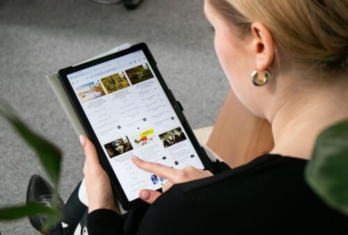 A picture showing a woman scrolling about social media marketing benefits